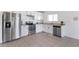 Modern kitchen with stainless steel appliances and white cabinets at 213 Lake Lucerne Way, Winter Haven, FL 33881