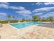 Community pool with plenty of lounge chairs at 213 Lake Lucerne Way, Winter Haven, FL 33881