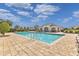 Community pool with lounge chairs and cabana at 213 Lake Lucerne Way, Winter Haven, FL 33881