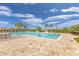 Community pool area with lounge chairs at 213 Lake Lucerne Way, Winter Haven, FL 33881