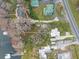 Stunning aerial view of a lakeside property with multiple buildings, docks, and mature trees at 2250 W County Road 44, Eustis, FL 32726