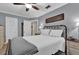 Comfortable bedroom featuring a bed with white linens and neutral decor at 2250 W County Road 44, Eustis, FL 32726