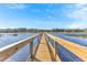 Picturesque wooden dock extending over calm water at 2300 Grasmere View S Pkwy, Kissimmee, FL 34746