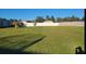 Large grassy backyard with a privacy fence at 233 Gladiola Ct, Poinciana, FL 34759