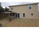 Back exterior view of the house with patio and gazebo at 233 Gladiola Ct, Poinciana, FL 34759