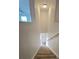 Interior view of carpeted staircase leading to the upper level at 233 Gladiola Ct, Poinciana, FL 34759