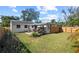 Large backyard with patio, gazebo, and wooden fence at 2501 Center Ave, Orlando, FL 32806