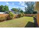 Landscaped backyard with a wooden fence and grassy area at 2501 Center Ave, Orlando, FL 32806