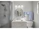 Clean bathroom with a marble vanity and a walk-in shower at 2501 Center Ave, Orlando, FL 32806