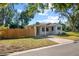 Mid-century modern home with a wooden fence at 2501 Center Ave, Orlando, FL 32806