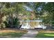 A peaceful lakeside path with a bench and stroller at 2501 Center Ave, Orlando, FL 32806