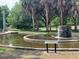 Serene park fountain with a circular pond and lush greenery at 2501 Center Ave, Orlando, FL 32806