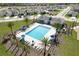 Aerial view of community pool with surrounding homes at 2523 Avalon Park Blvd, Tavares, FL 32778