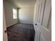 Simple bedroom with carpet and neutral walls at 2523 Avalon Park Blvd, Tavares, FL 32778