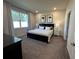 Spacious bedroom with plush carpeting and large windows at 2523 Avalon Park Blvd, Tavares, FL 32778