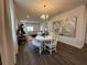 Bright dining room with table, chairs, and hardwood floors at 2523 Avalon Park Blvd, Tavares, FL 32778