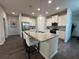 Modern kitchen with island and stainless steel appliances at 2523 Avalon Park Blvd, Tavares, FL 32778