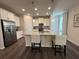 Modern kitchen with island and stainless steel appliances at 2523 Avalon Park Blvd, Tavares, FL 32778