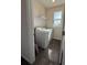 Laundry room with washer, dryer, and shelving at 2523 Avalon Park Blvd, Tavares, FL 32778