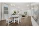 Bright and airy living room with a dining area, wood floors, and recessed lighting at 2523 Avalon Park Blvd, Tavares, FL 32778