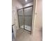 Large walk-in shower with neutral tile and glass door at 2523 Avalon Park Blvd, Tavares, FL 32778