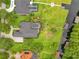 Aerial view showcasing home, pool, and lakefront lot at 2682 Wyndsor Oaks Pl, Winter Haven, FL 33884