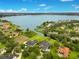 Aerial view of lakefront property and surrounding area at 2682 Wyndsor Oaks Pl, Winter Haven, FL 33884