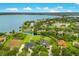 Expansive aerial showcasing lakefront home and community at 2682 Wyndsor Oaks Pl, Winter Haven, FL 33884