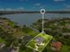 Aerial view of house and property with lake access at 2682 Wyndsor Oaks Pl, Winter Haven, FL 33884