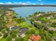 Lakefront home and neighborhood aerial perspective at 2682 Wyndsor Oaks Pl, Winter Haven, FL 33884