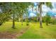 Landscaped backyard with stone path and lush greenery at 2682 Wyndsor Oaks Pl, Winter Haven, FL 33884