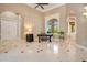 Bright entryway with tile floors, a desk, and views to the backyard at 2682 Wyndsor Oaks Pl, Winter Haven, FL 33884