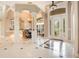 Elegant entryway with high ceilings, tiled floors and formal dining area at 2682 Wyndsor Oaks Pl, Winter Haven, FL 33884