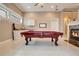 Game room with pool table, wet bar, and fireplace at 2682 Wyndsor Oaks Pl, Winter Haven, FL 33884