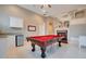 Game room features a pool table and a fireplace at 2682 Wyndsor Oaks Pl, Winter Haven, FL 33884