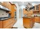 Well-equipped kitchen featuring stainless steel appliances and an island at 2682 Wyndsor Oaks Pl, Winter Haven, FL 33884