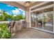 Outdoor kitchen with stainless steel grill and sliding glass doors at 2682 Wyndsor Oaks Pl, Winter Haven, FL 33884