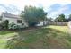 Large backyard with grassy area and mature trees at 2779 Prince John Rd, Winter Park, FL 32792