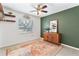 Bedroom with an accent wall and floating shelves at 2779 Prince John Rd, Winter Park, FL 32792