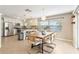 Dining area with wood table and six chairs, near kitchen at 2779 Prince John Rd, Winter Park, FL 32792