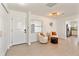 Bright and airy entryway with tile floors and seating area at 2779 Prince John Rd, Winter Park, FL 32792