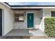 Teal front door and whitewashed brick exterior at 2779 Prince John Rd, Winter Park, FL 32792