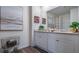 Modern bathroom with double vanity and a large mirror at 2977 Moulin Rd, Davenport, FL 33837