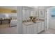 Double vanity bathroom with granite countertop and a view of the bedroom at 2994 Salisbury Ave, Haines City, FL 33844