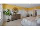 Bright bedroom featuring a large dresser and comfortable bedding at 2994 Salisbury Ave, Haines City, FL 33844