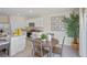 Kitchen with white cabinets, granite countertops, and a round wooden table at 2994 Salisbury Ave, Haines City, FL 33844