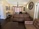 Cozy living room featuring a brown leather sofa and hardwood floors at 303 Cricket Hollow Ln, Eustis, FL 32726