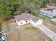 House with brown roof, driveway, and yard at 3054 Shallowford St, Deltona, FL 32738