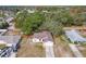 Aerial view of a house with brown roof and a yard at 3054 Shallowford St, Deltona, FL 32738