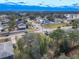 Aerial view of neighborhood showing houses, roads, and surrounding greenery at 3054 Shallowford St, Deltona, FL 32738